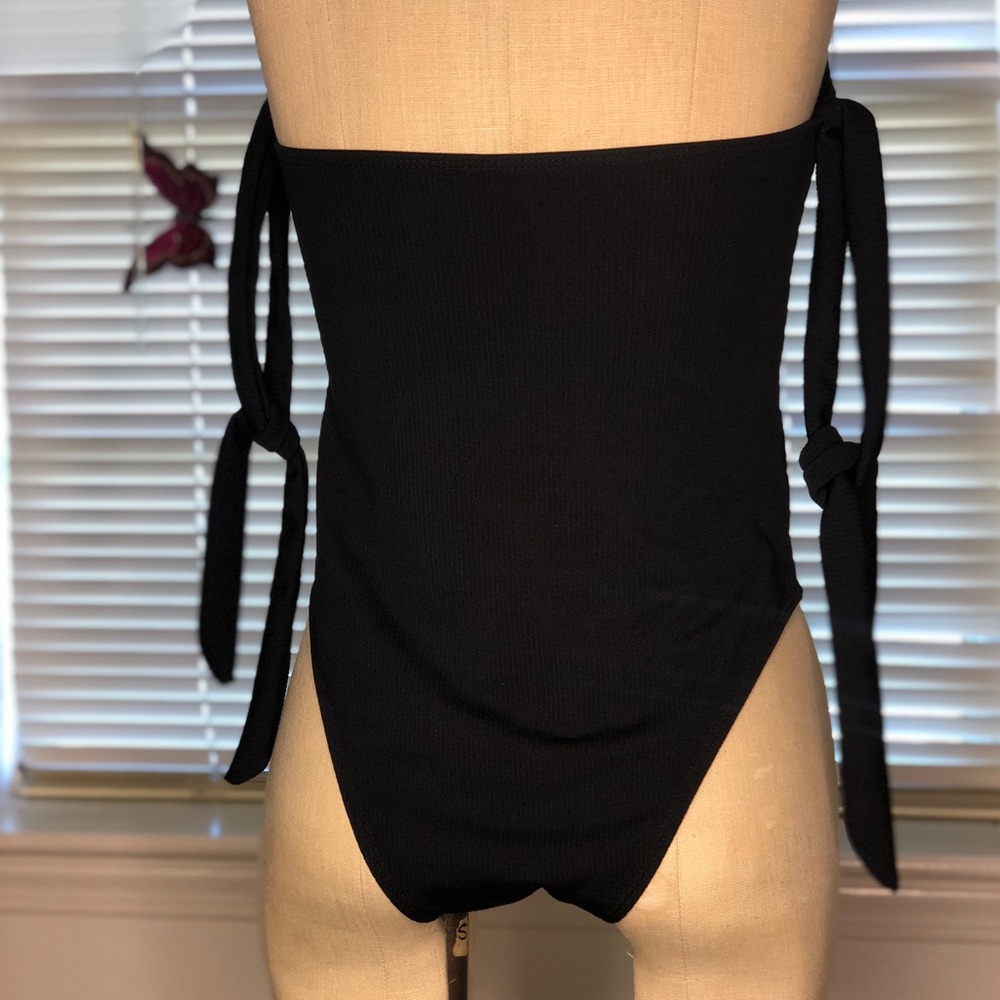 Tube top black one piece swimsuit.